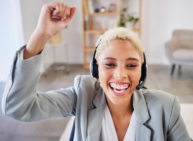 Photo winner success or excited black woman in call center company in celebration of winning a business deal smile remote work or happy insurance agent celebrates reaching sales target goals or mission