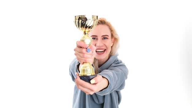 Photo winning competitions a young woman with a golden cup