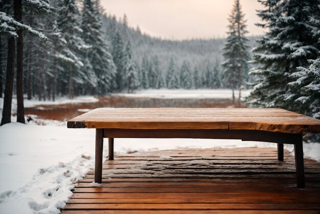 Winter background with copy space on a wooden desk with a winter view of pine trees