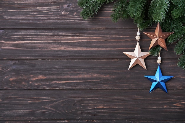 Winter background with fir branches and Christmas decorations in form of star