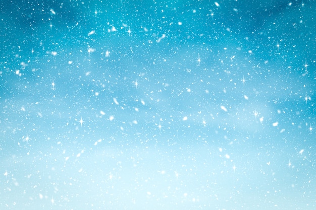 雪と青のグラデーションカラーでキラキラと冬の背景。