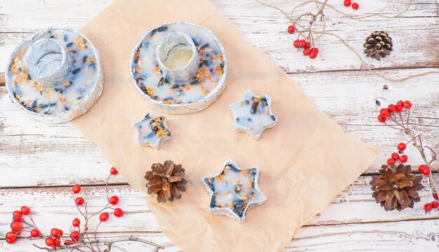 Winter bird feeder on a white wooden background