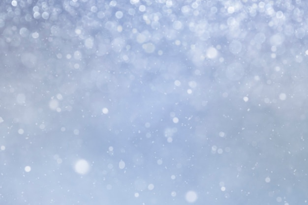 winter blue background with bokeh snowflakes