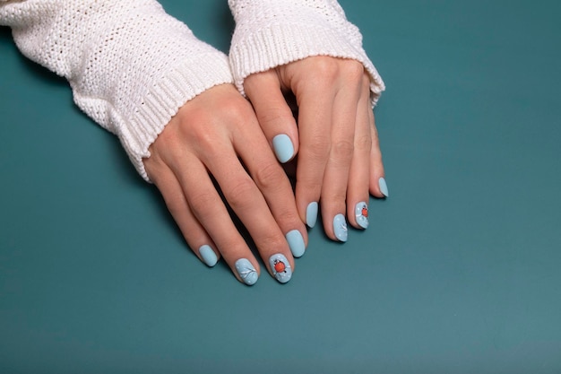 Premium Photo | Winter Blue Manicure Gel Polish With Stickers Under A Matte  Top