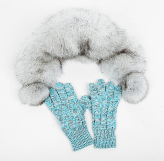 Winter cap and mittens, isolated on white surface