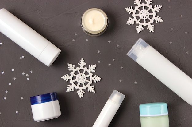 Photo winter care cosmetics on a colored background top view