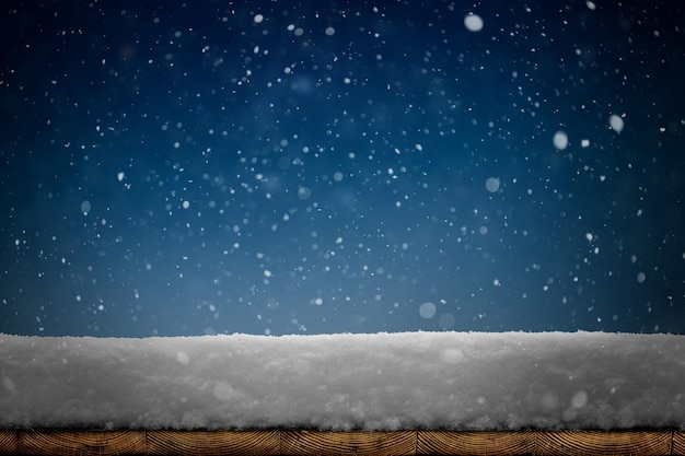 A winter Christmas background with snow on the wood