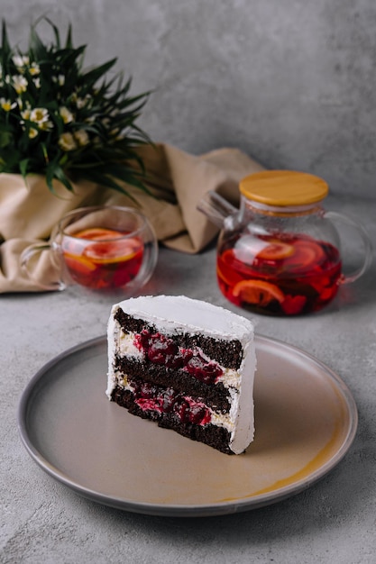 Winter christmas cake with cherries with tea