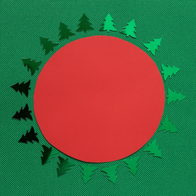Winter Christmas circle template with green evergreen trees