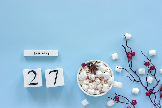 Winter composition. White wooden calendar cubes.