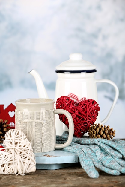 Winter composition with hot beverage on nature background