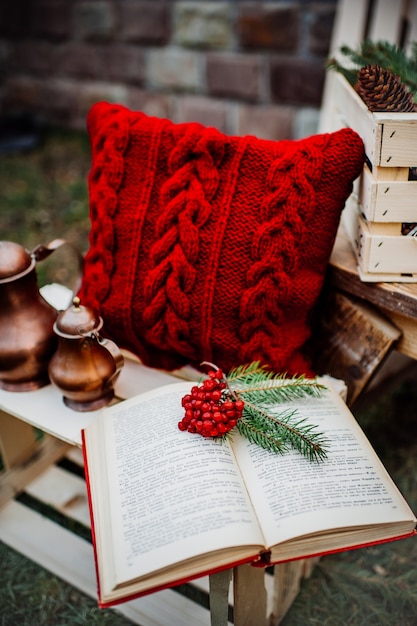 winter decor, pillow, kettle, book, box outdoors