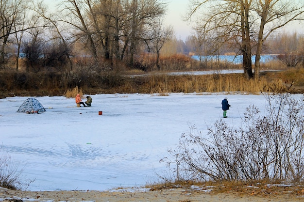 Winter fishing on the frozen lake