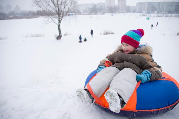 Winter fun and gamesLittle boy enjoying a sleigh ride