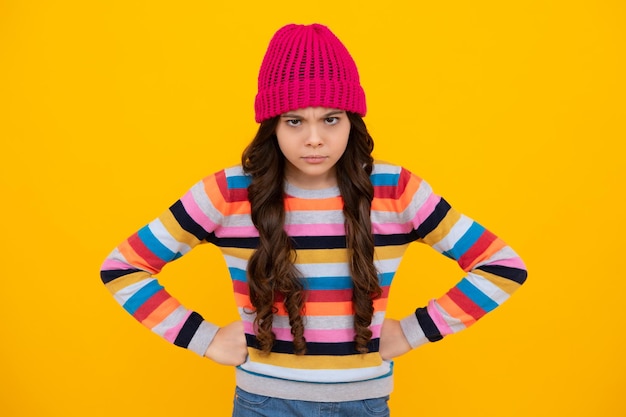 Winter hat Cold season concept Winter fashion accessory for children Teen girl wearing warm knitted hat Unhappy sad teenager girl