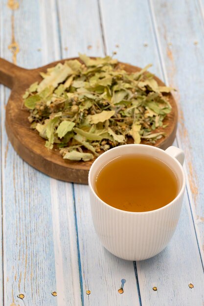 Winter herbal tea on a blue wood background linden tea
immuneboosting herbal tea medicinal tea prepared from linden leaves
clove particles and chamomile