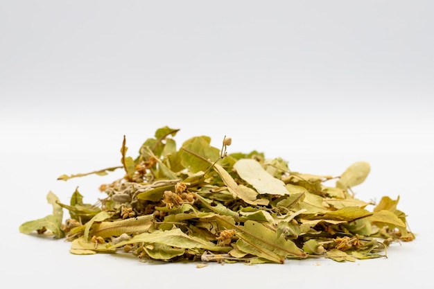 Winter herbal tea on a white background linden tea medicinal
tea prepared from linden leaves clove particles and chamomile