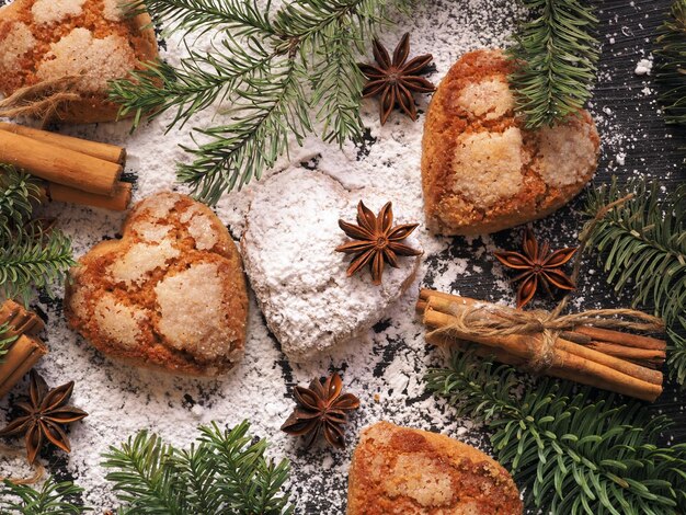 Winter holiday concept cinnamon star anise cookies spruce branches