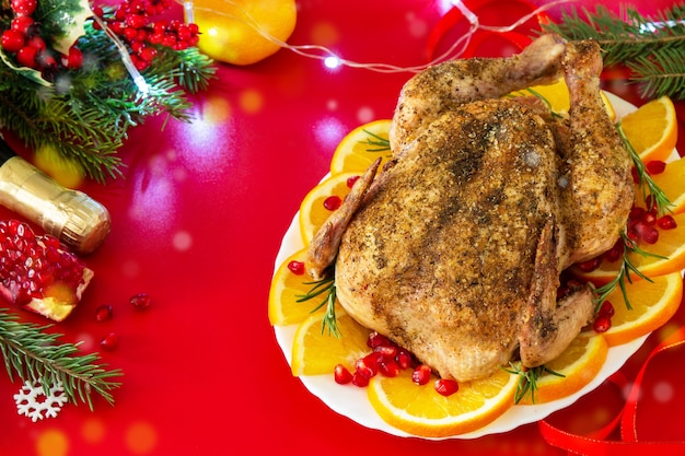 Winter Holiday table Christmas dinner Baked turkey on red background Copy space