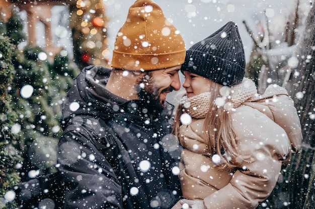 Winter holidays and people concept happy father and little daughter choosing christmas tree at street market Choosing and buying a Christmas tree at the Christmas market