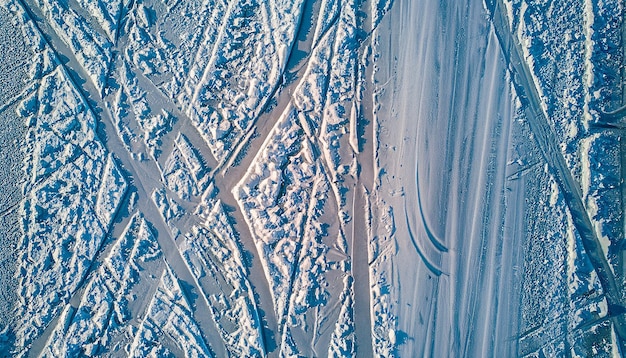 Winter ice traces of skates texture abstract background top view aerial photography