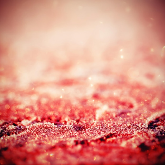 Winter iced glowing red pattern with bokeh, holiday seasonal background