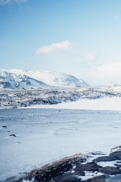 Winter Iceland landscape Traveling along the Golden Ring in Iceland by car Winter when the ground and the mountains are covered by snow Winter road