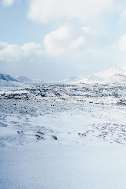 Winter iceland landscape traveling along the golden ring in\
iceland by car winter when the ground and the mountains are covered\
by snow