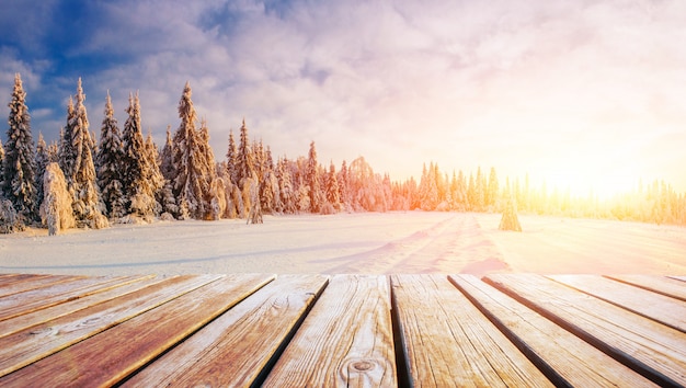 Winter landscape and shabby table on a sunset. Mountains Carpathians, Ukraine