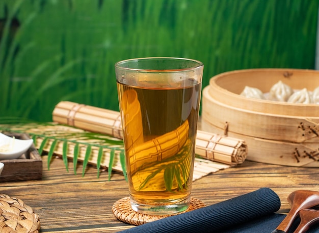 Winter Melon tea with napkin served in a wooden dish side view of taiwan food