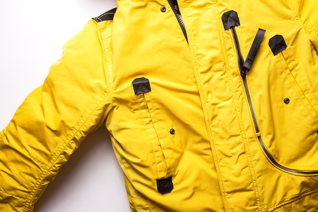 Winter men's yellow jacket on a white background.