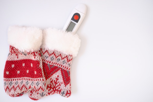 Winter mittens and thermometer.