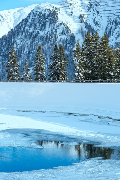 Winter mountain landscape with lake. Kappl ski region in the Tyrolean mountains, Austria.