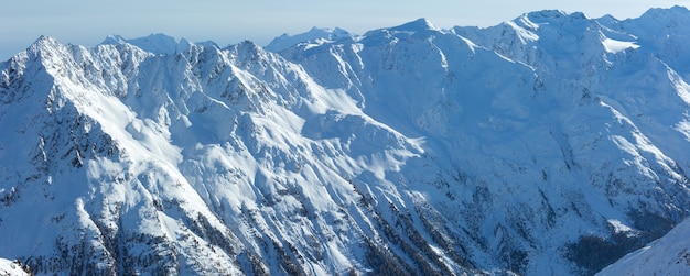 Winter mountain scenery from cabin ski lift at snowy slopes (Tyrol, Austria).