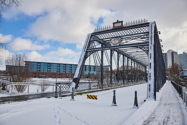 Winter Pedestrian Bridge with Modern City Backdrop Fort Wayne