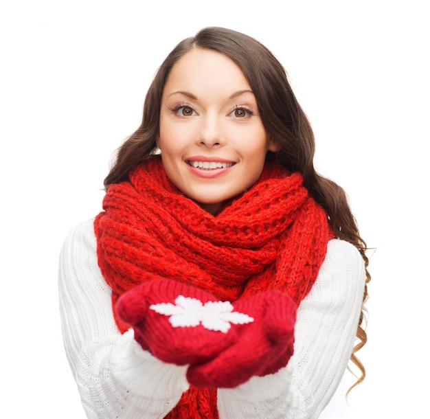 winter, people, happiness concept - woman in scarf and gloves with big snowflake