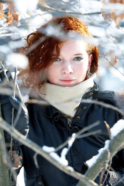 winter portrait of a beautiful woman freezing