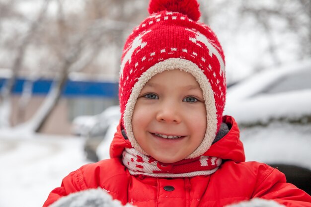 Winter portrait of little boy in warm clothes