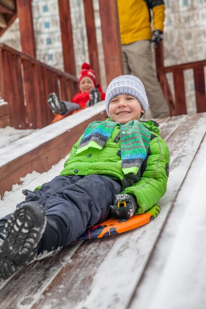 Winter portrait of little boys in warm clothes