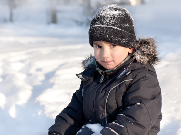 Winter portrait of young cute boy