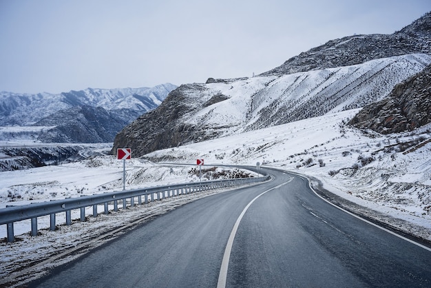 Winter road in mountains. Snow.