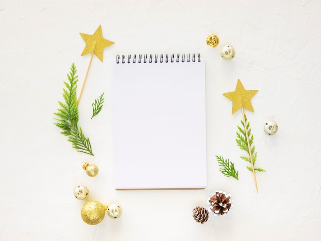 Winter sale banner top view mockup empty notebook on white background with xmas decorations copy