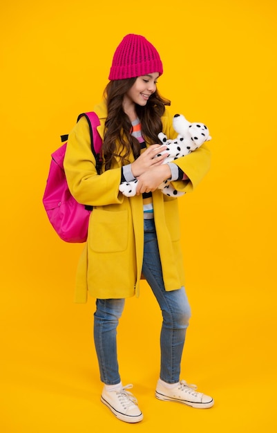 Winter school Funny school girl with toy Happy childhood and kids education Knowledge day Happy teenager positive and smiling emotions of teen girl