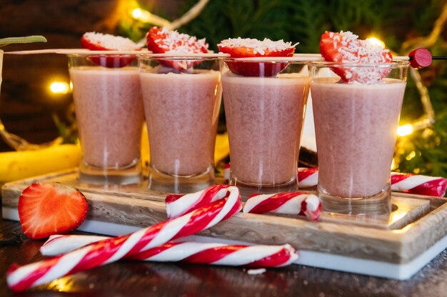 Winter shot cocktails with strawberry on the table in restaurant