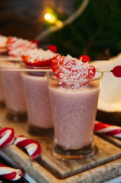 Winter shot cocktails with strawberry on the table in restaurant