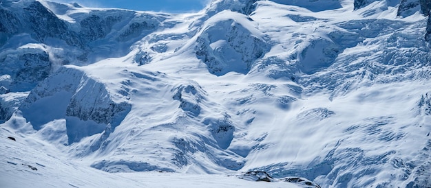 Winter snow covered mountain peaks in Zermatt Switzerland