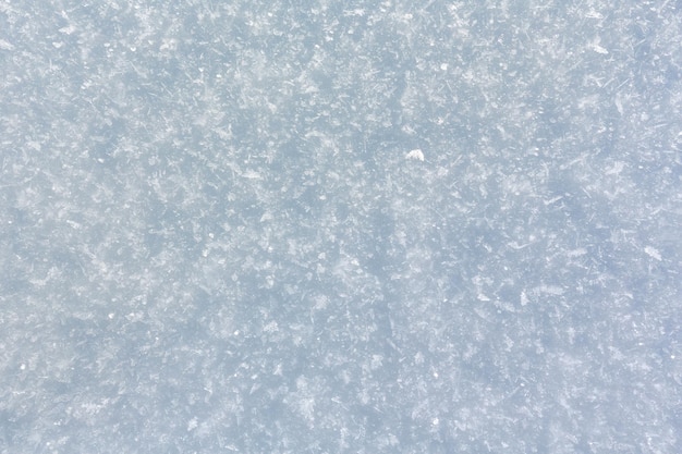 Winter snow surface with crystalline snowflakes