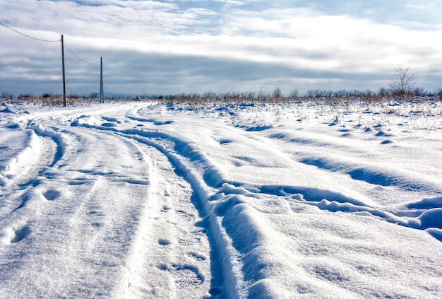 Winter snowy rural field road