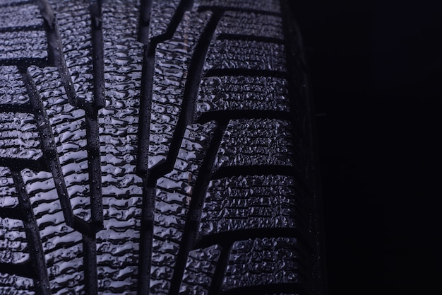 Winter tires on a dark background