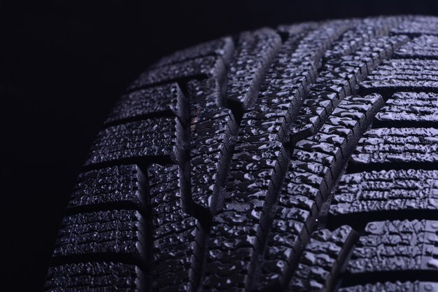 Winter tires on a dark background